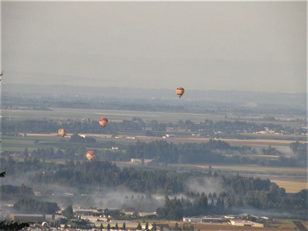 Hot air balloons rise above Newberg