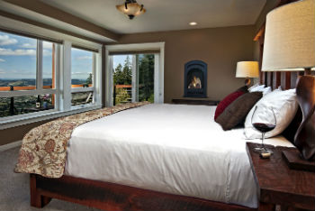 Bed, fireplace and windows of the High Desert Suite