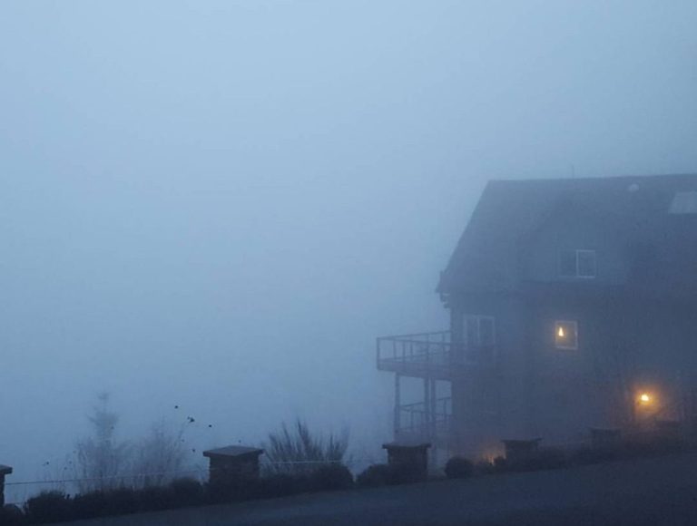 a house in the midst of a dense cloud