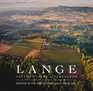 Ariel photo of Lange Winery with the words "Lange Estate Winery & Vineyards Rooted in the Dundee Hills since 1987"