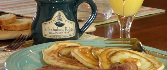 pancakes with apples and a mug