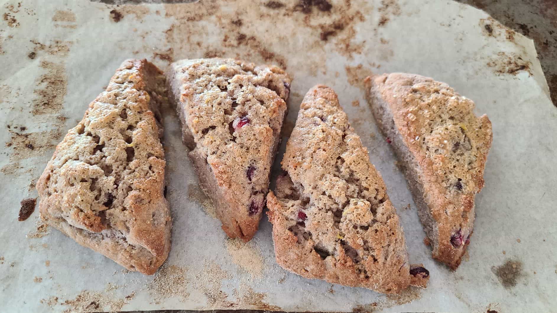 four glute-free scones sitting on a piece of parchment paper