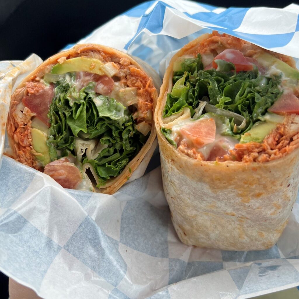 A buffalo chicken wrap with lettuce, tomatoes, and blue cheese dressing from That's a Wrap food truck in Newberg