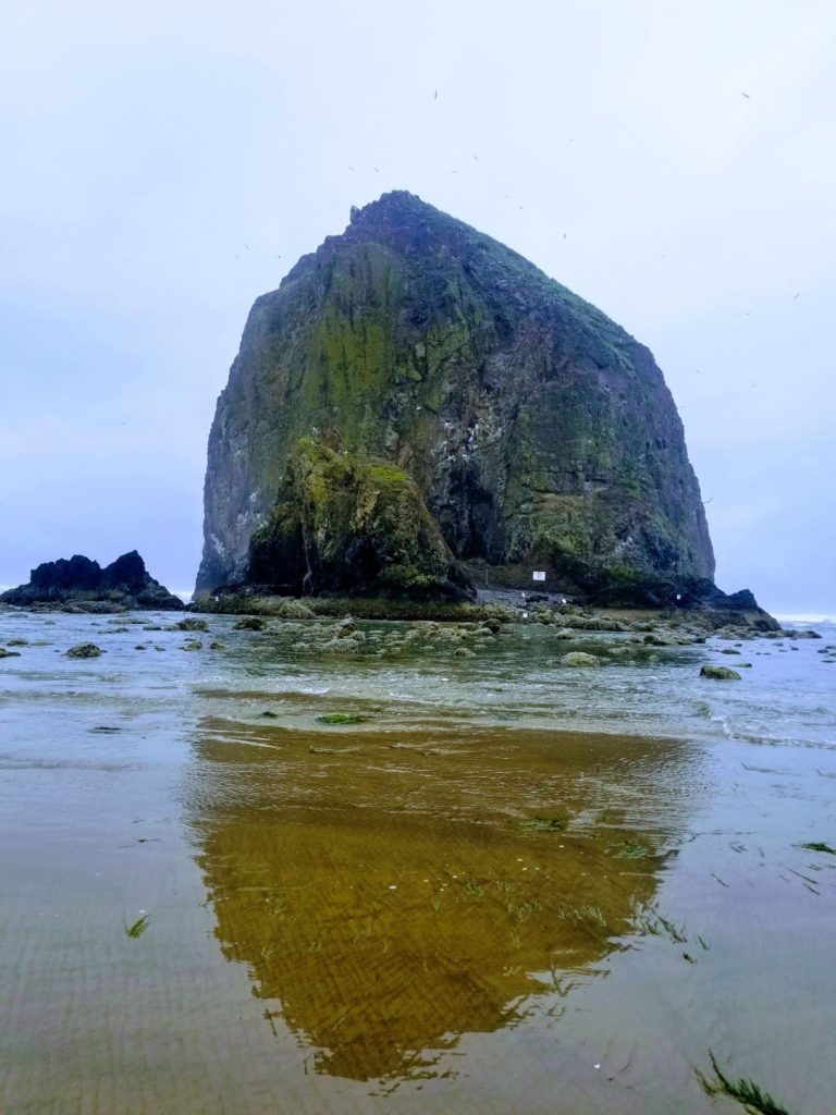 the haystack shaped rock in the water at Cannon Beach, Oregon