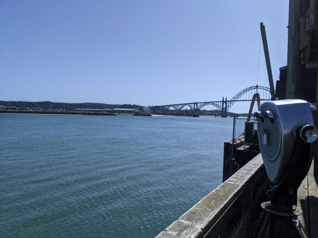 Newport Oregon's marina with an arch bridge in the background