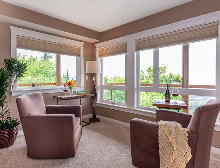 Sitting Area with large windows and chairs in High Desert Suite