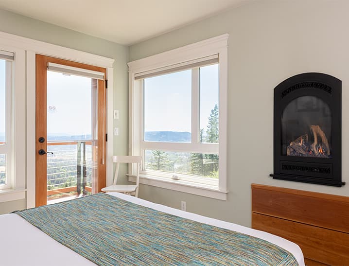 Fireplace and large windows in Oregon Coast Room