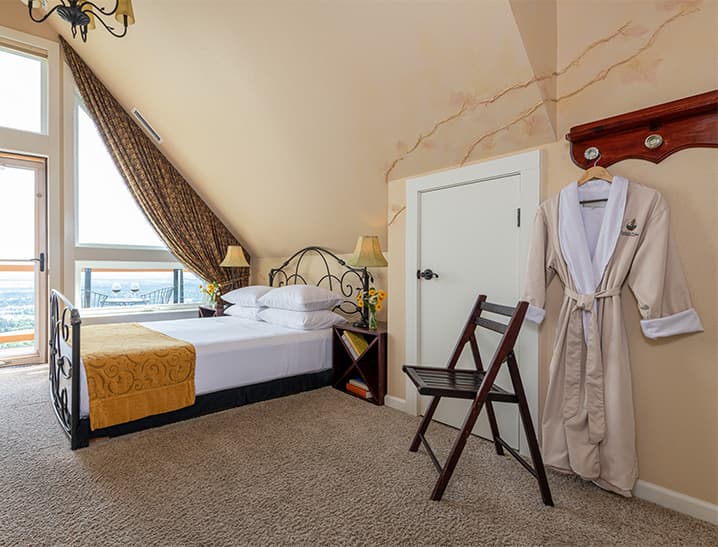 Bed and Chair in Wine Country Room with Robe